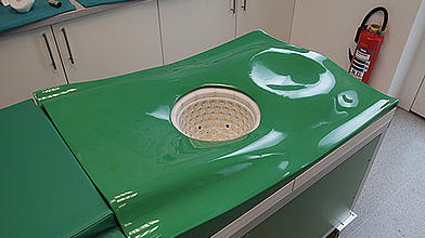 Patient couch with examination basin